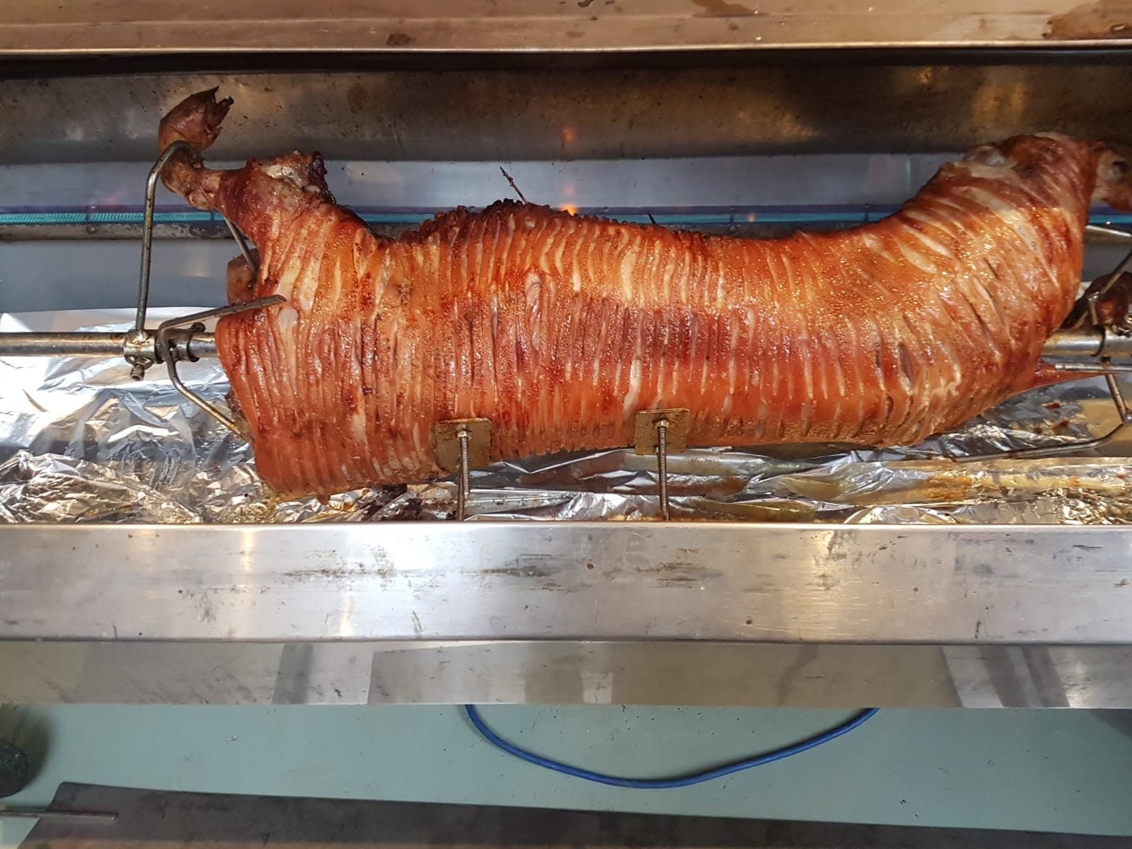 A Razzles hog roast on the spit